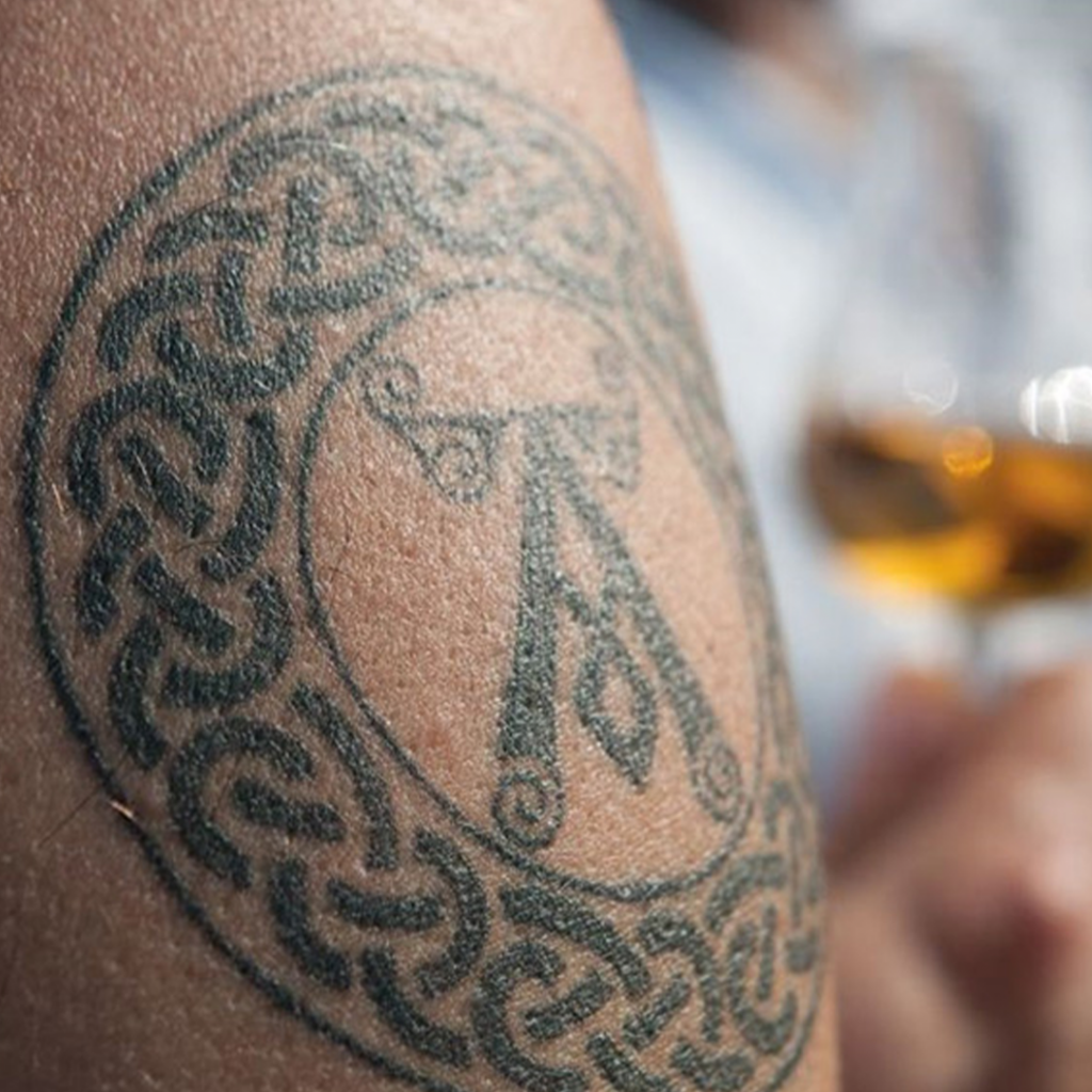 Ardbeg fan with tattoo of Ardbeg Distillery logo