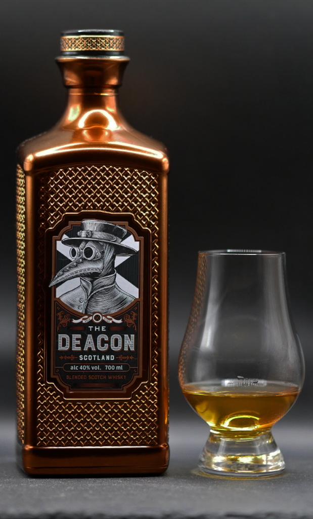 The Deacon whisky bottle with Glencairn glass of whisky